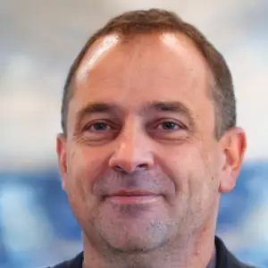 Healthy middle-aged man smiling after using Kerassentials